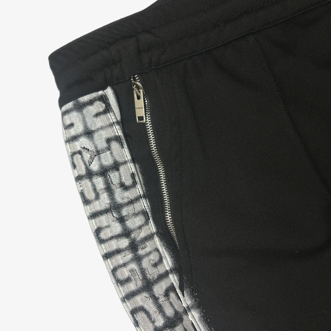 Givenchy men's black tracksuit pants with white graffiti monogram print