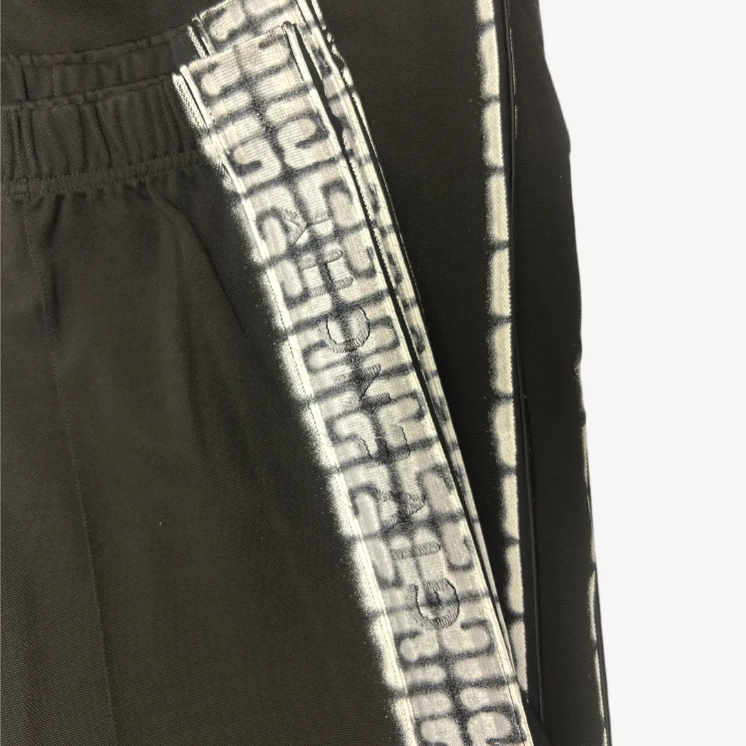 Givenchy men's black tracksuit pants with white graffiti monogram print