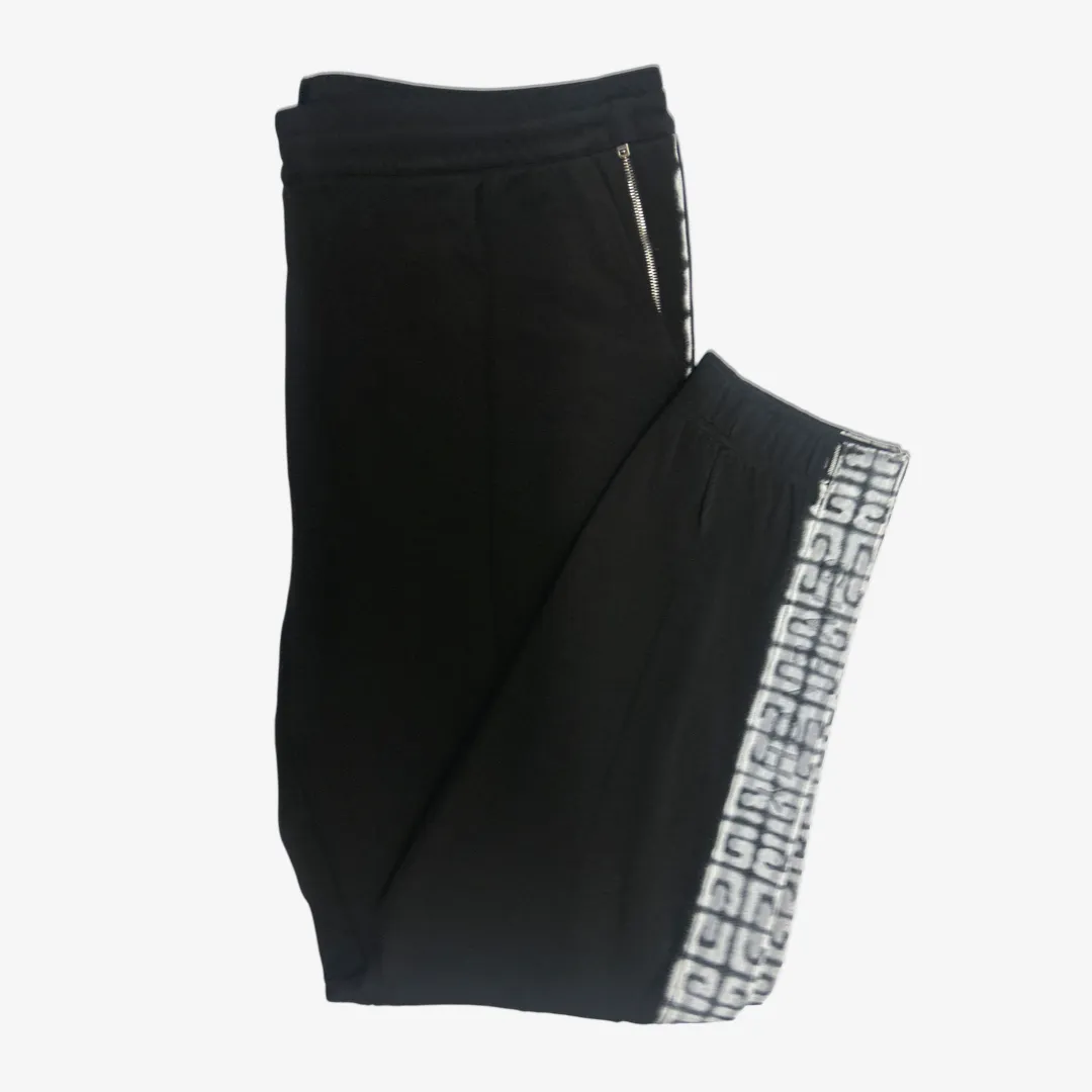 Givenchy men's black tracksuit pants with white graffiti monogram print